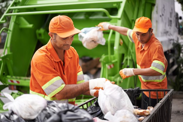 Cropped shot of a garbage collection team at work