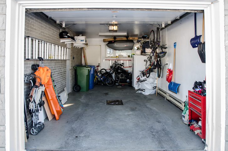 A clean, organized garage with bikes and tools neatly stored.
